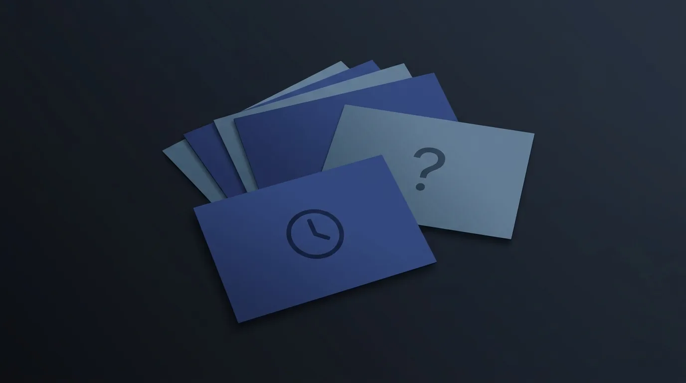 A stack of small note cards on a desk, one marked with a clock and a question mark, illustrating the difference between a timed question and an open one.